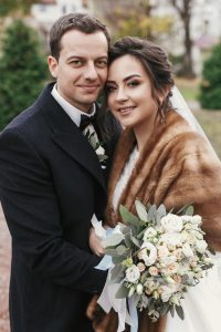 gorgeous-bride-with-bouquet-and-stylish-groom-gently-hugging.jpg